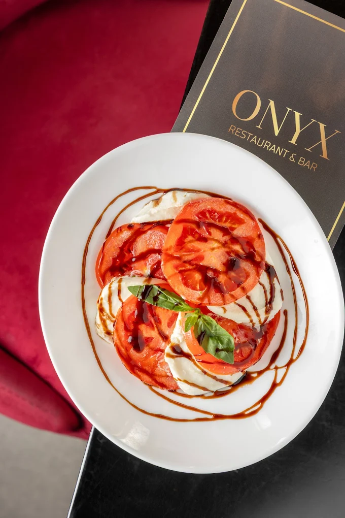 Caprese dish served on top of an Onyx menu