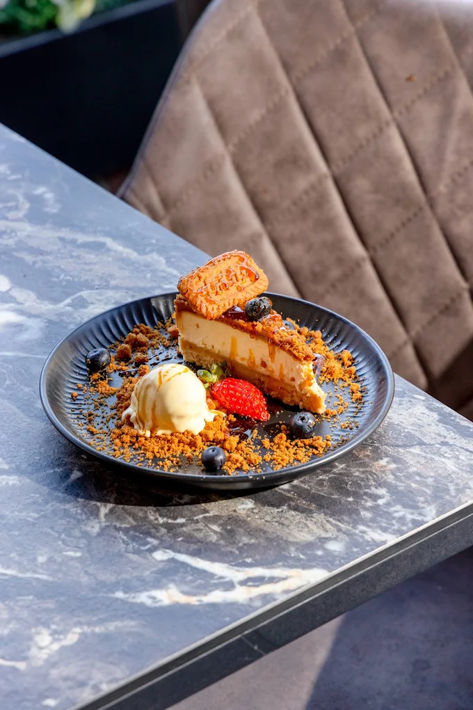 Berry crumble dessert plated at Onyx