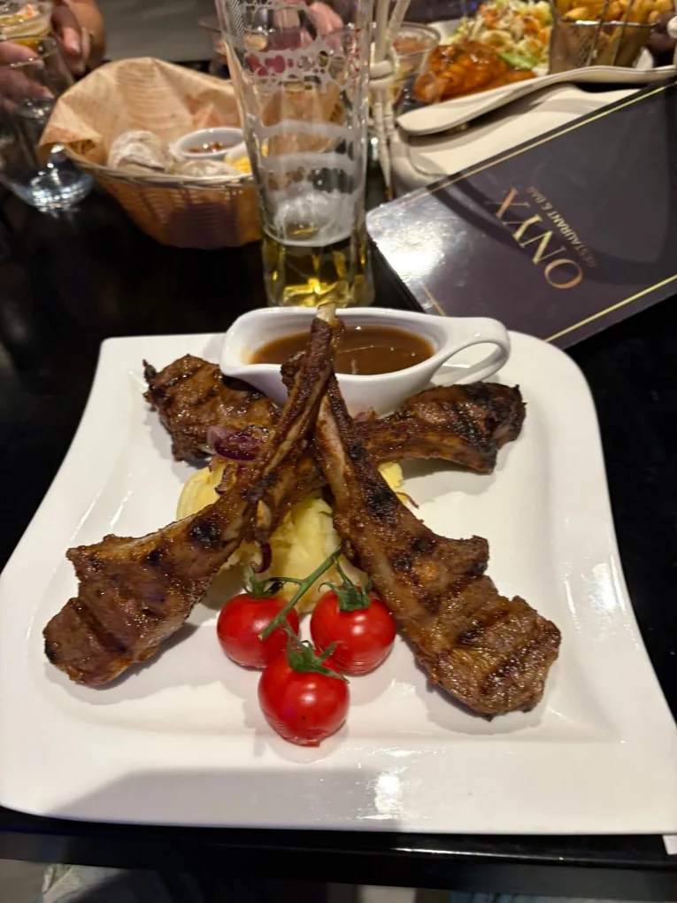 Lamb cutlets served on a board