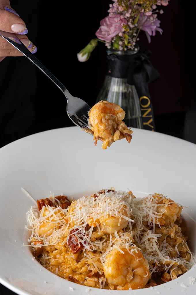 Pasta lifted on a fork from the plate