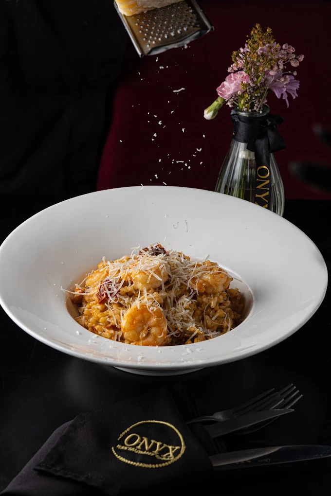 Pasta finished with parmesan at the table