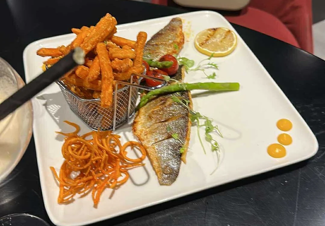 Seabass dish served with fries