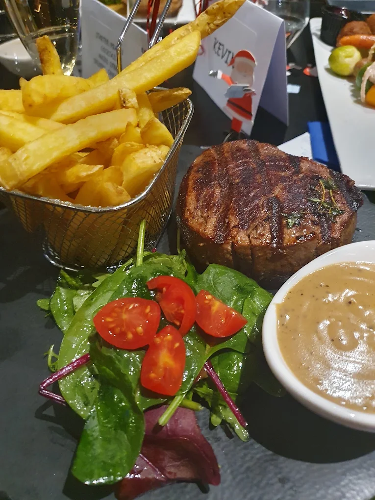 Steak served with fries and salad