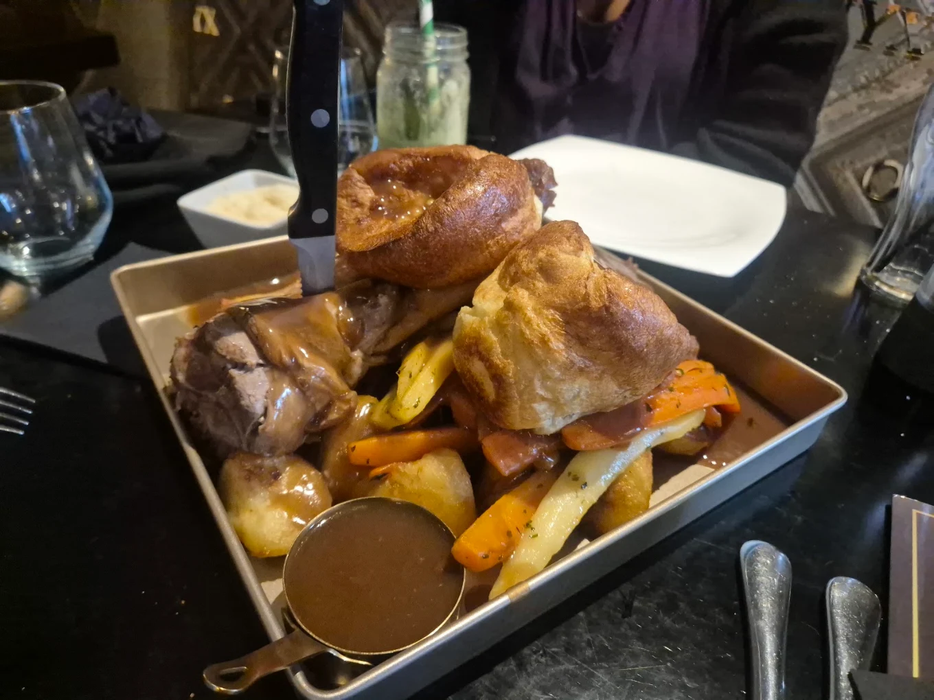 Sunday roast serving tray with vegetables and Yorkshire puddings